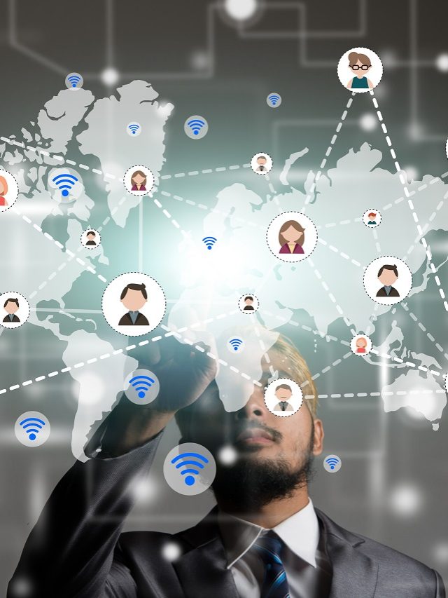 Businessman touch screen with global and people icon. Digital te